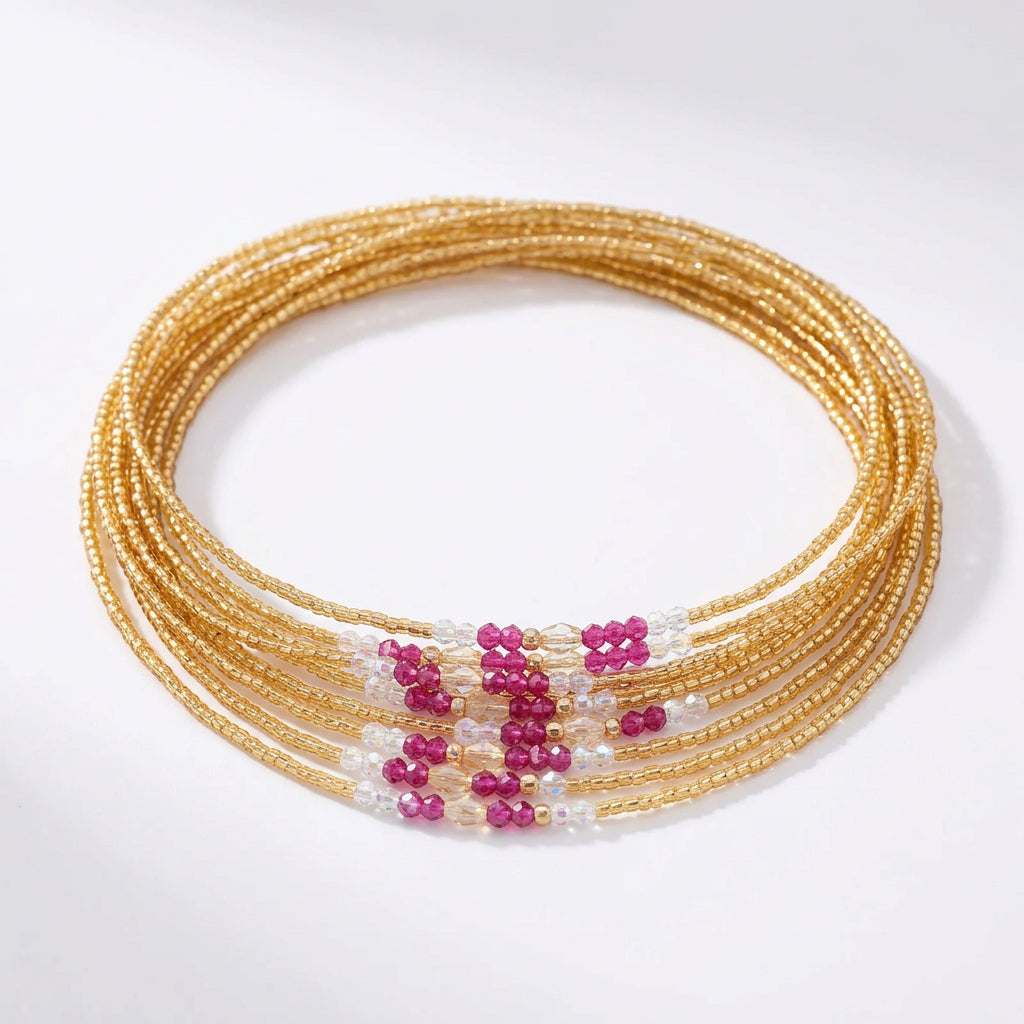 Waistbeads goud, fuchsia en kristal