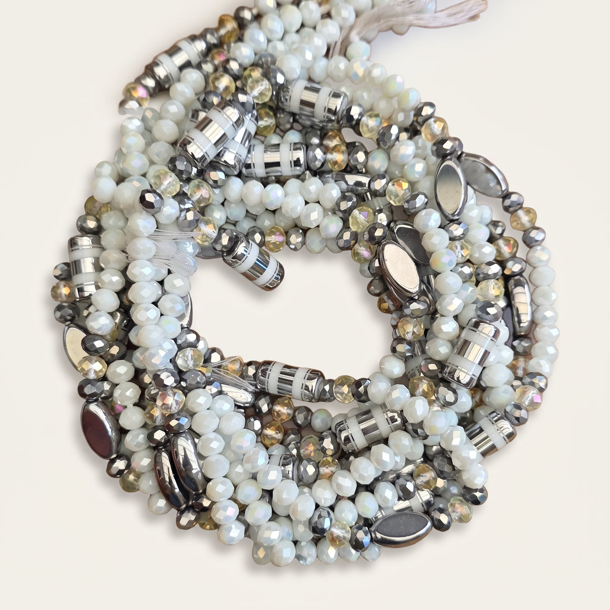 Parelwitte waistbeads met zilverkleurige en champagnekleurige details